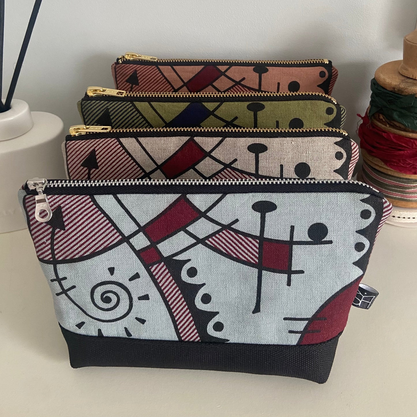 Jazz medium washbag in deep red on chalk blue