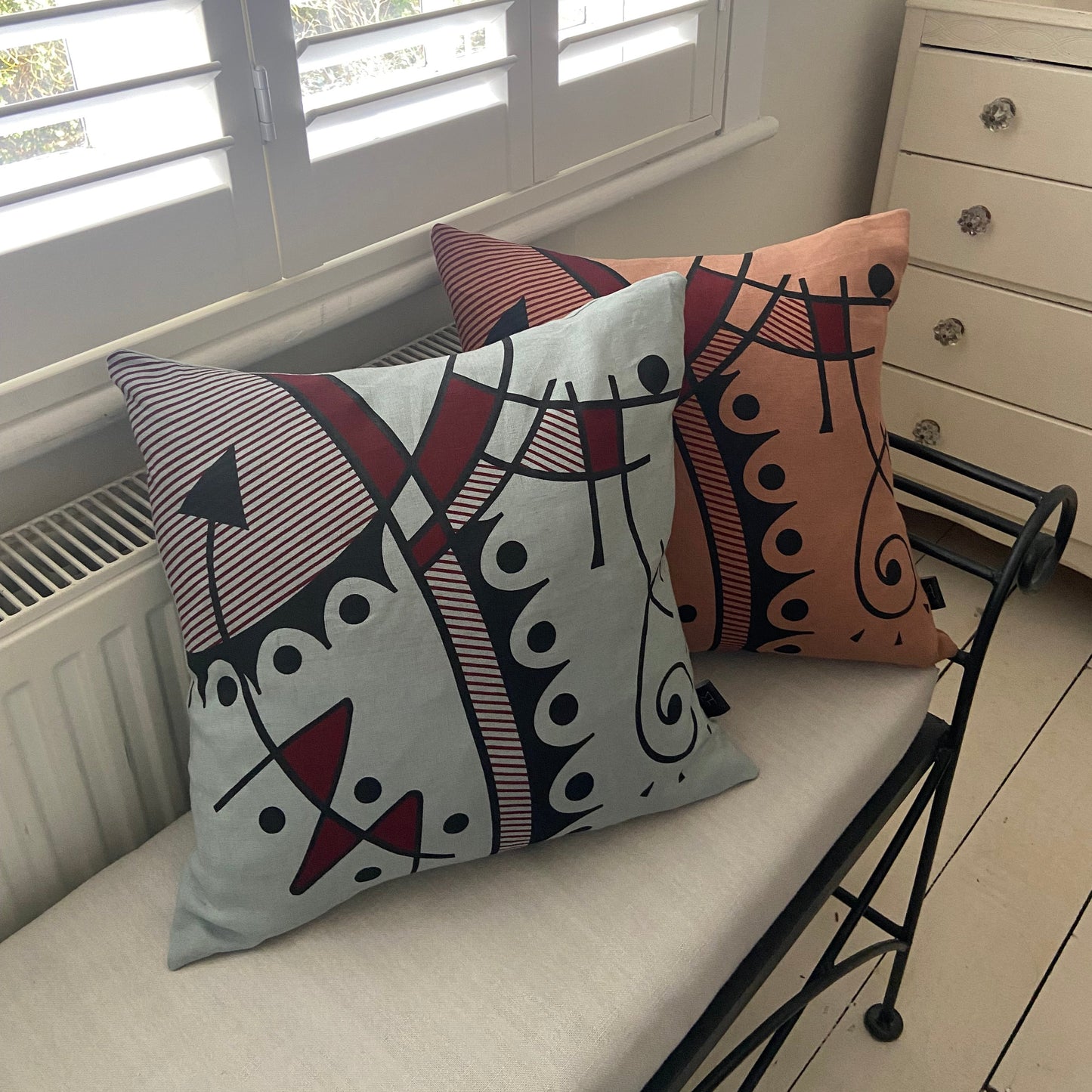 Jazz cushion cover in deep red on chalk blue