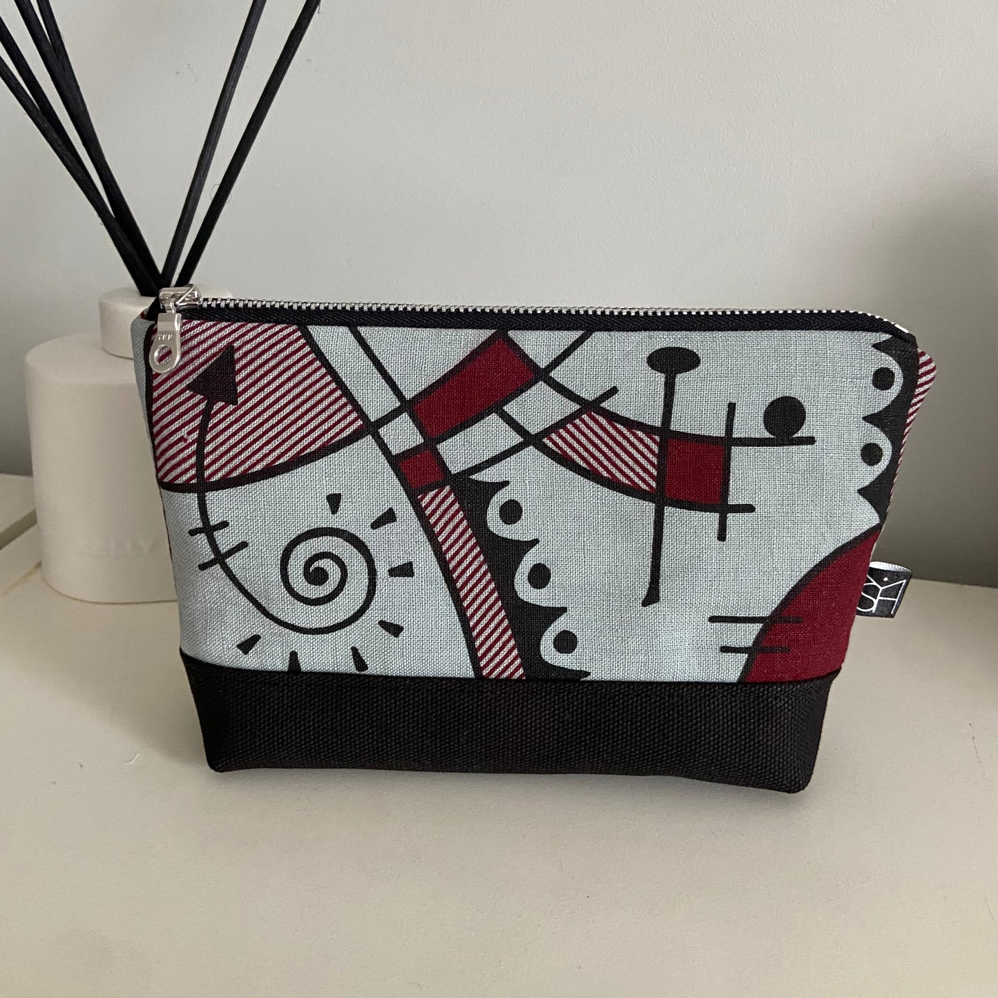 Jazz medium washbag in deep red on chalk blue