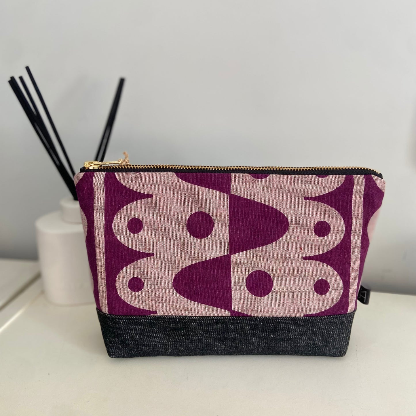 Rhythm large washbag in plum on pink