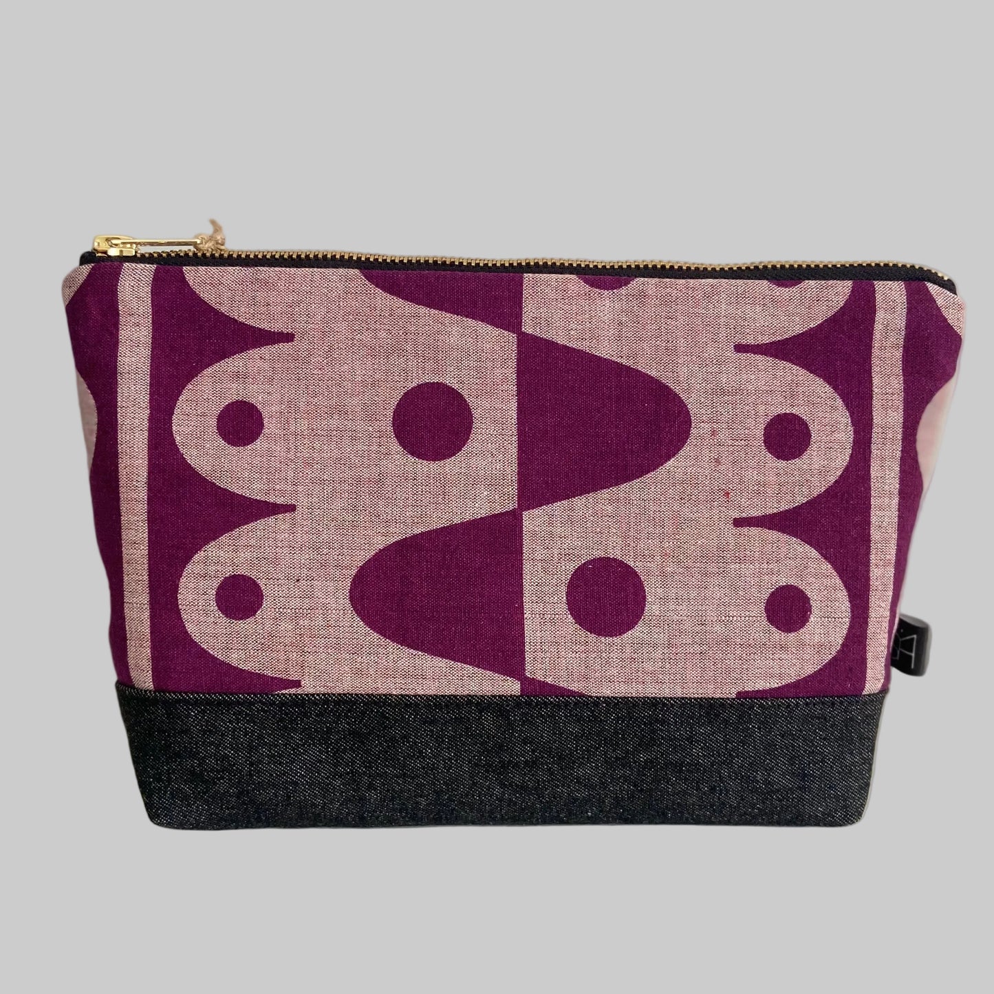 Rhythm large washbag in plum on pink