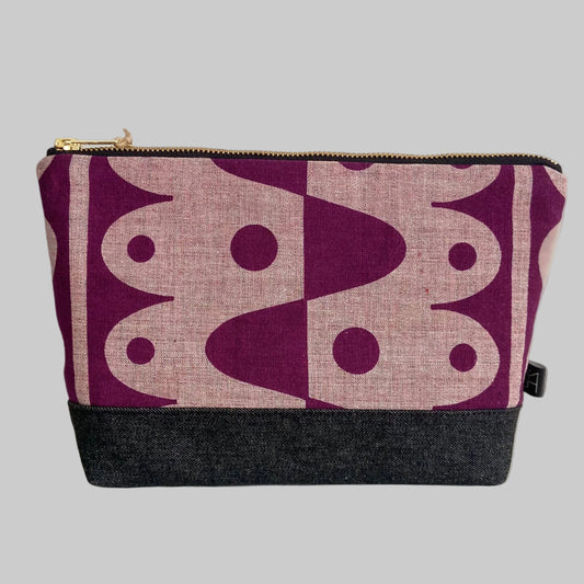 Rhythm large washbag in plum on pink